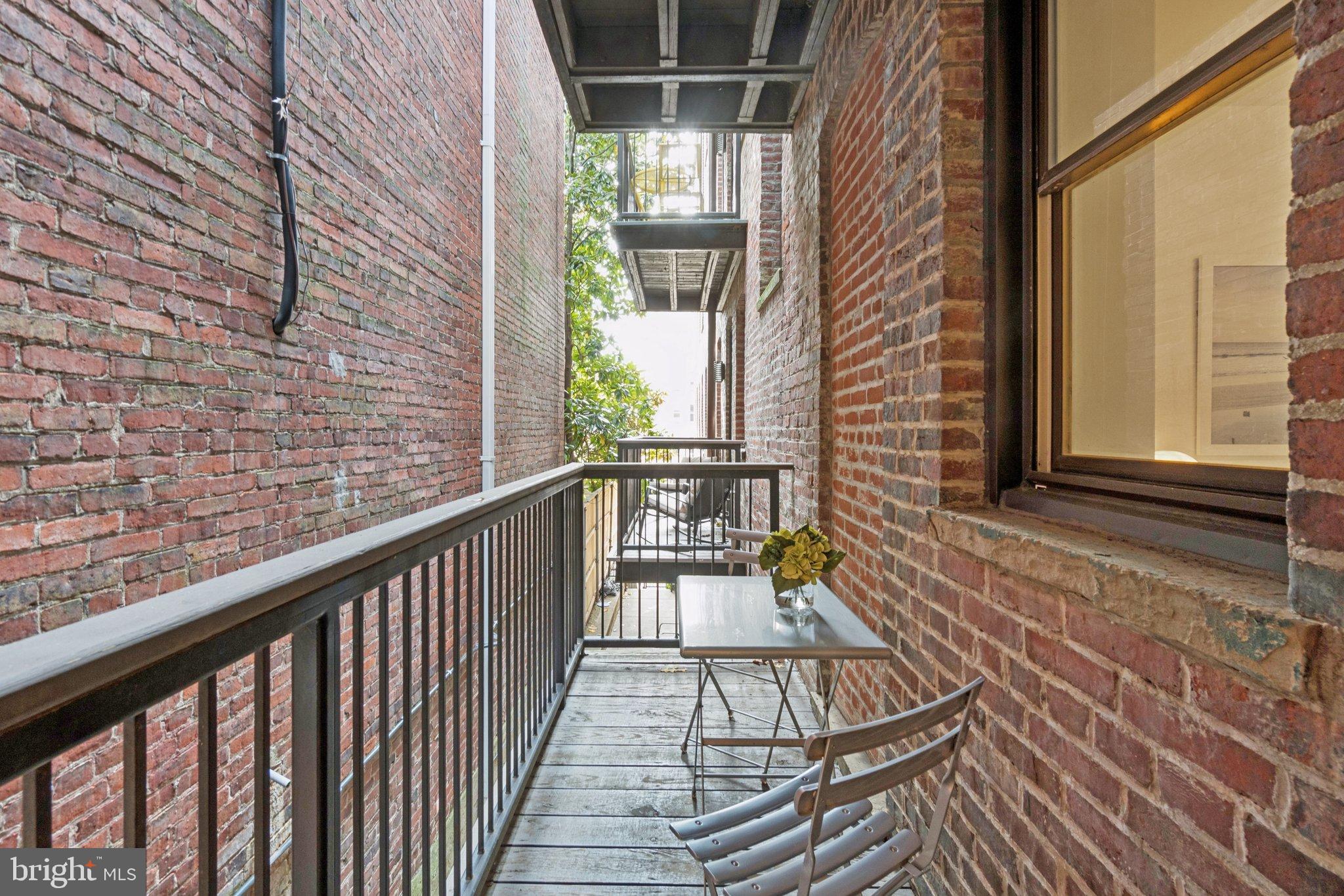 1840 Vernon Street Northwest, Unit 208 Washington, DC 20009 - Photo 14 of 26 a view of a balcony with wooden floor