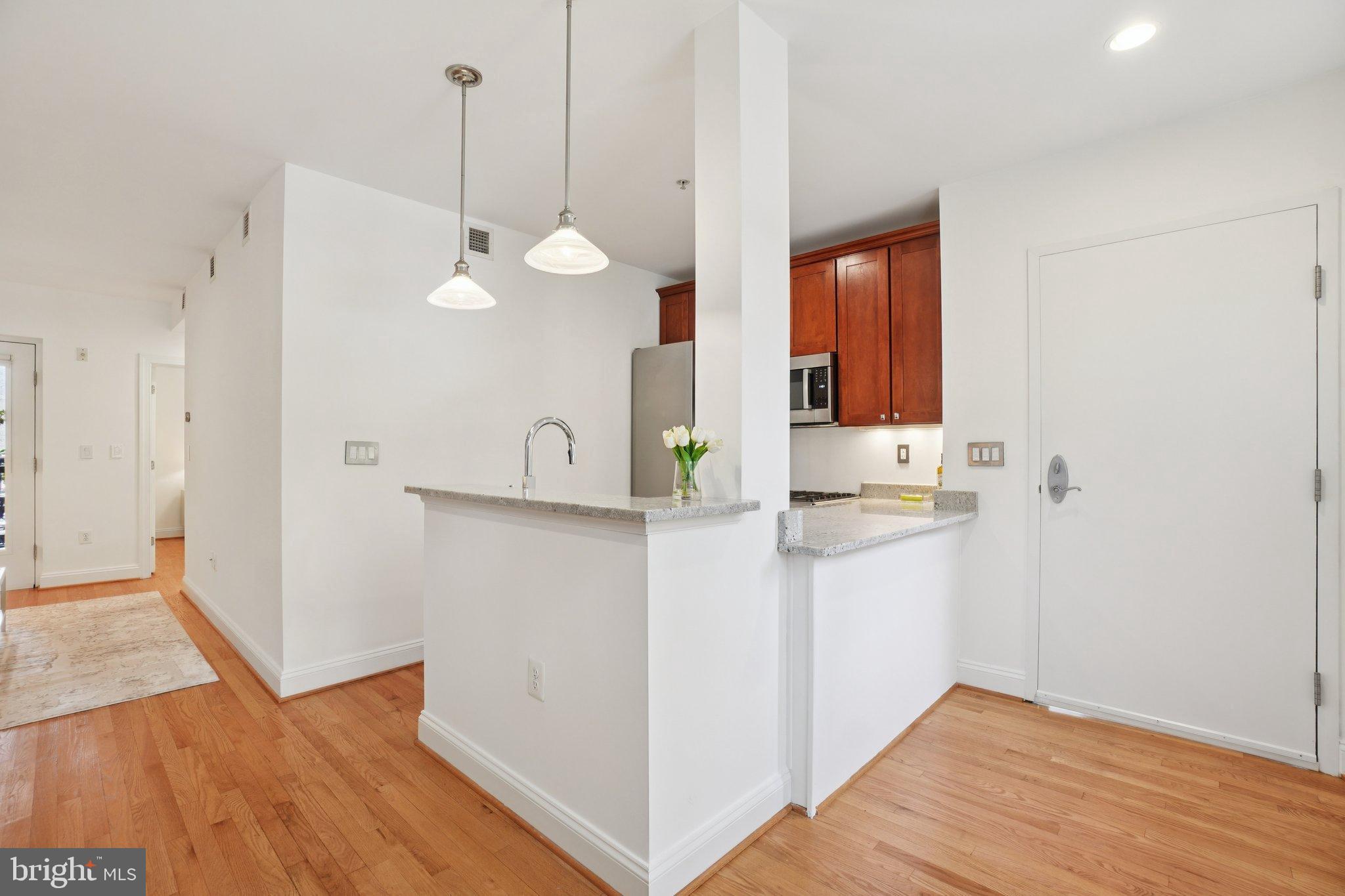 1840 Vernon Street Northwest, Unit 208 Washington, DC 20009 - Photo 19 of 26 a view of a kitchen from the hallway