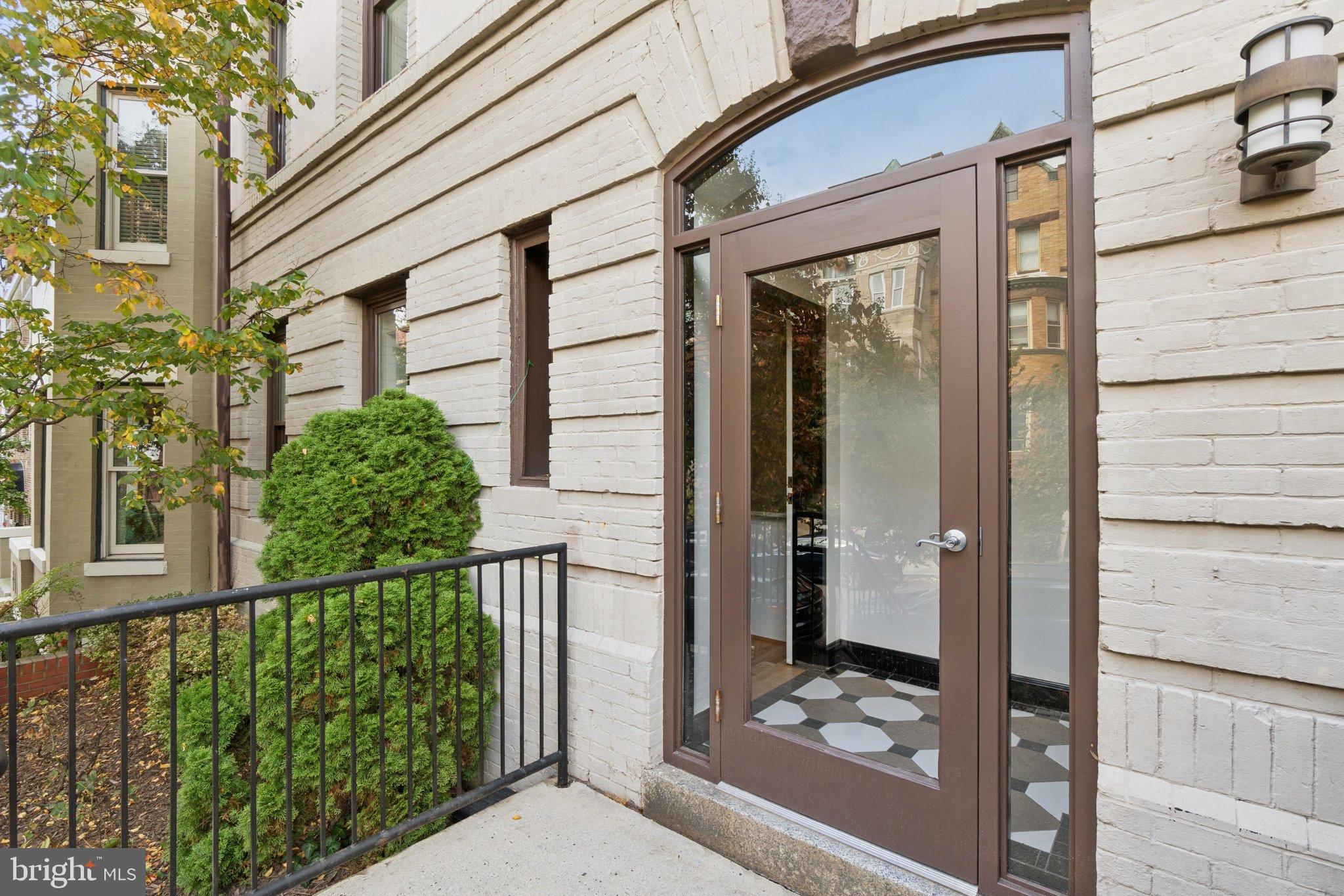 1840 Vernon Street Northwest, Unit 208 Washington, DC 20009 - Photo 2 of 26 a view of a porch with a floor to ceiling window and wooden floor