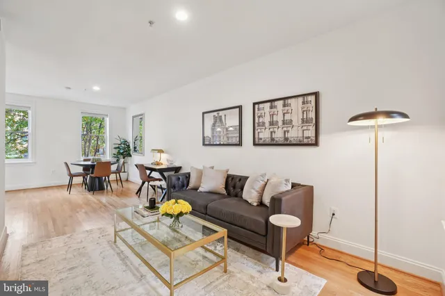a living room with furniture and white walls