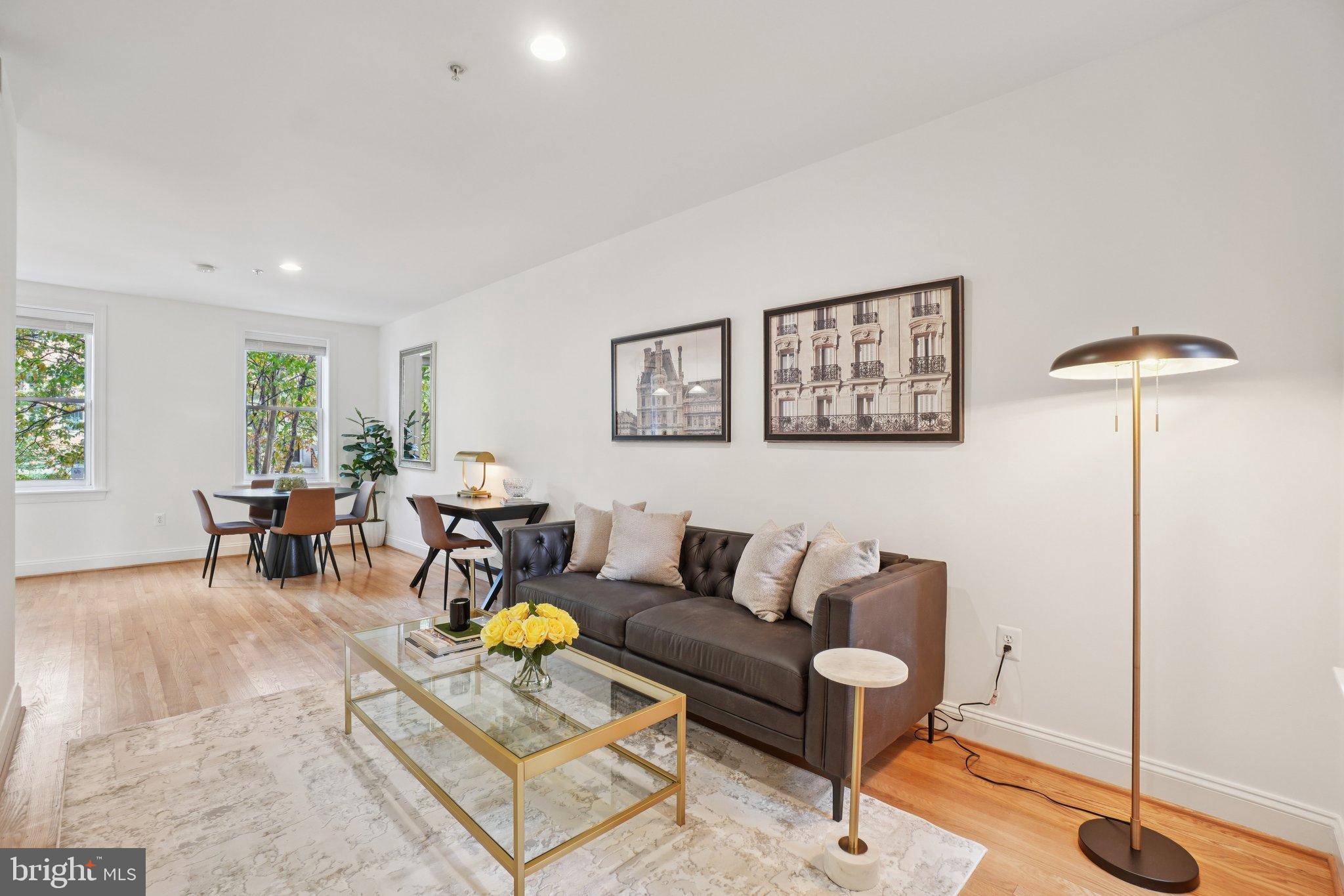 1840 Vernon Street Northwest, Unit 208 Washington, DC 20009 - Photo 5 of 26 a living room with furniture and white walls