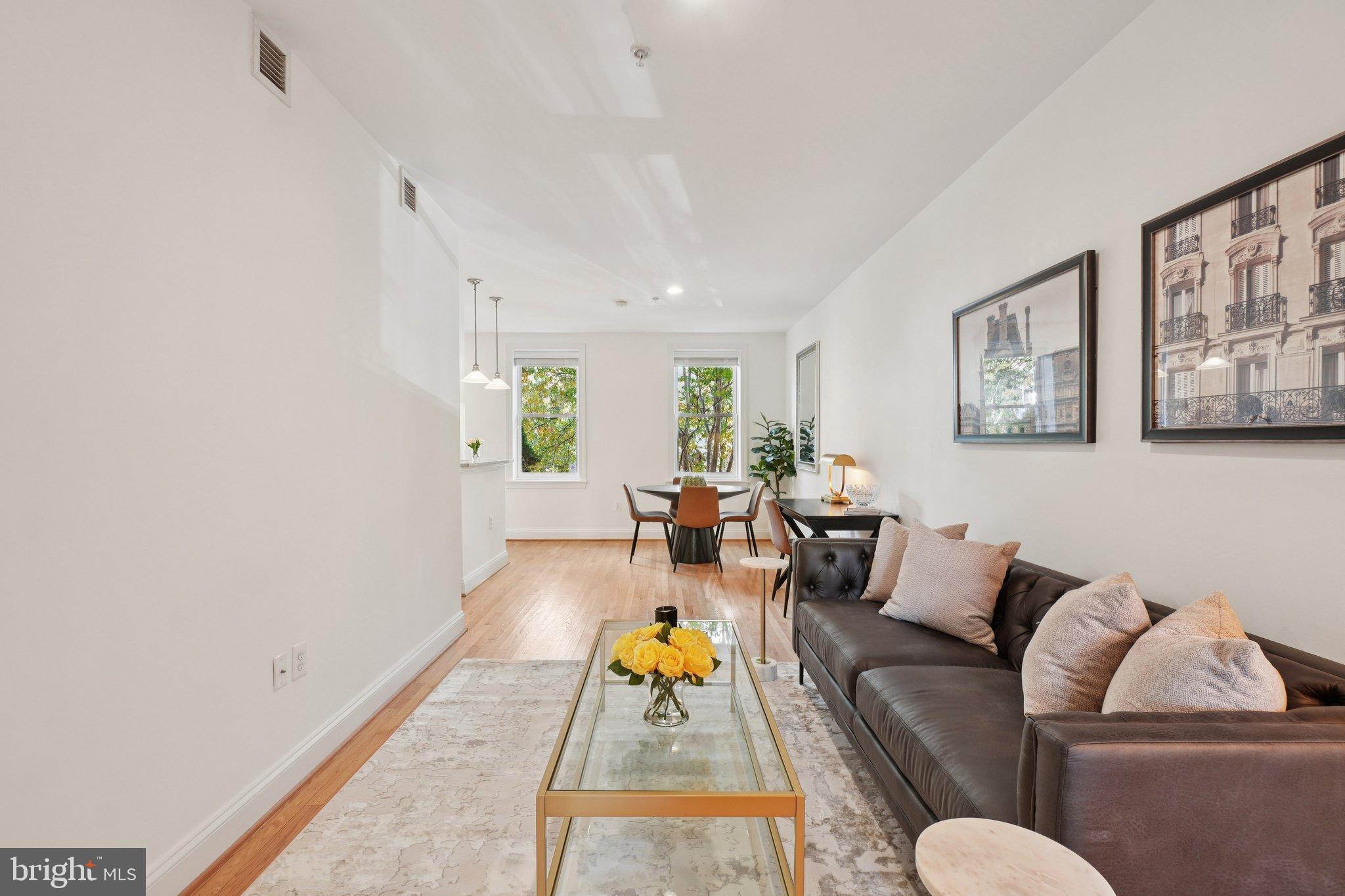 1840 Vernon Street Northwest, Unit 208 Washington, DC 20009 - Photo 7 of 26 a living room with furniture and wooden floor