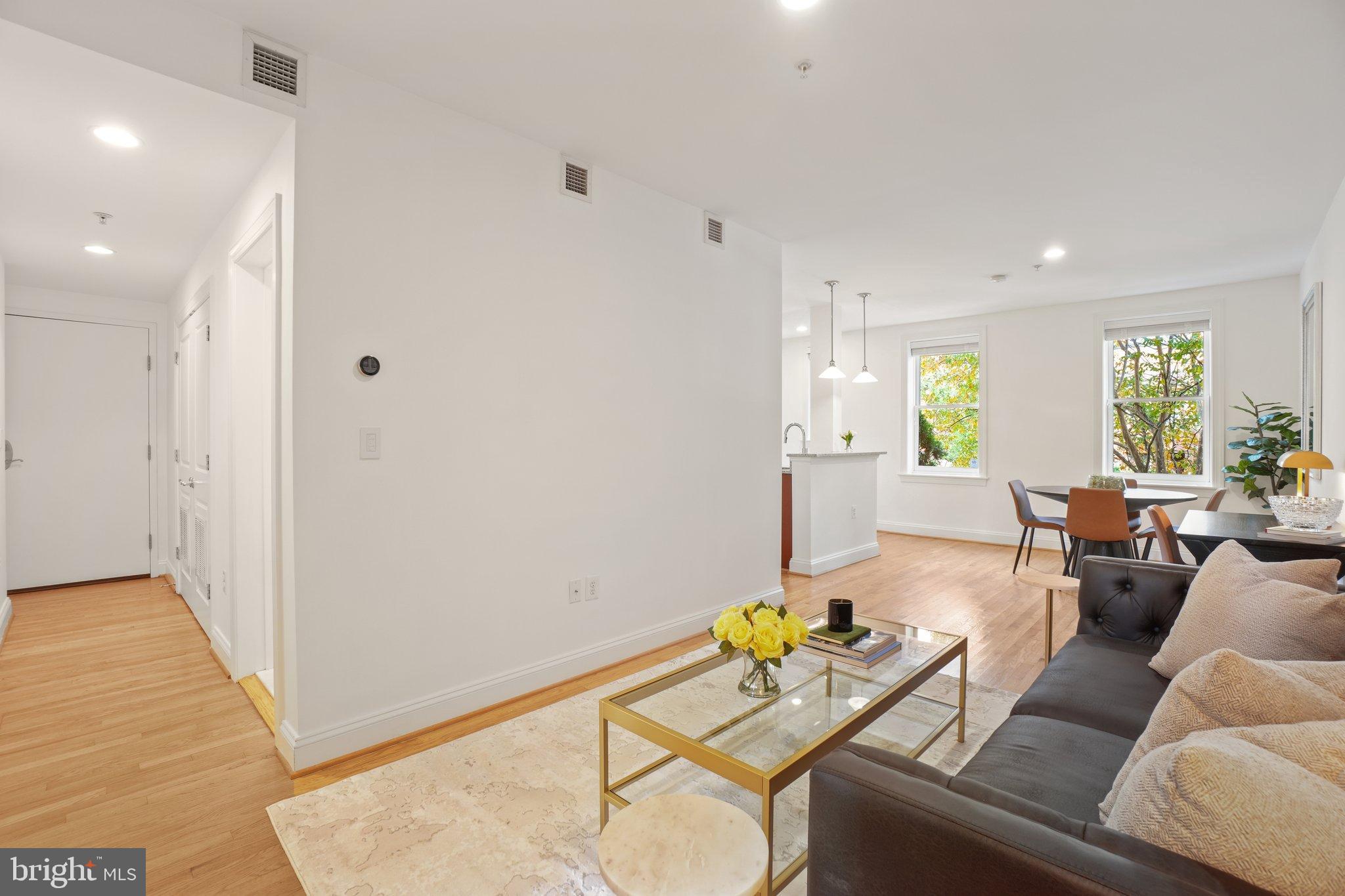 1840 Vernon Street Northwest, Unit 208 Washington, DC 20009 - Photo 8 of 26 a living room with furniture and wooden floor