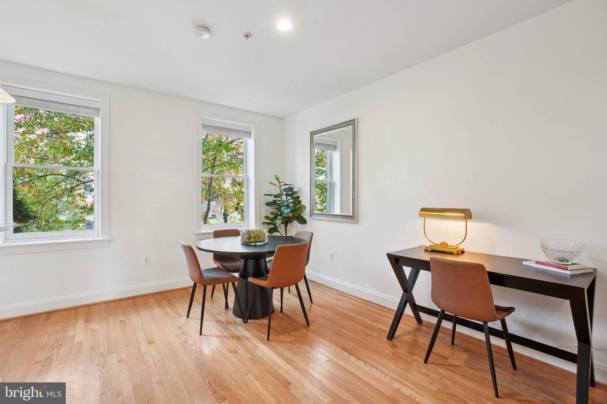 1840 Vernon Street Northwest, Unit 208 Washington, DC 20009 - Photo 10 of 26 a view of a dining room with furniture window and wooden floor