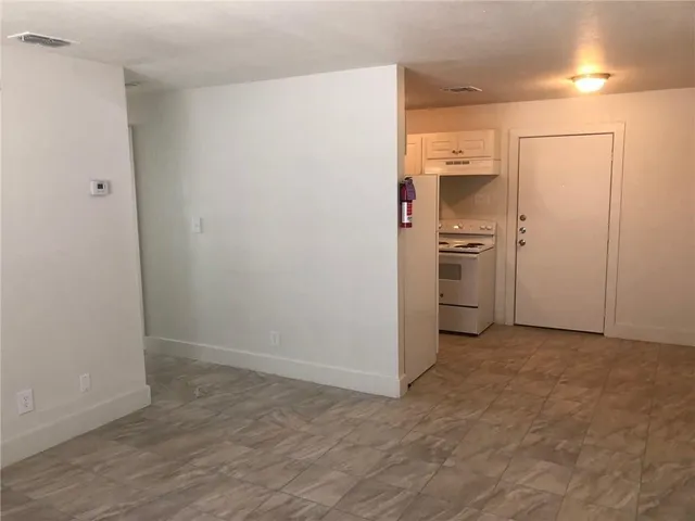 a white refrigerator freezer sitting inside of a kitchen