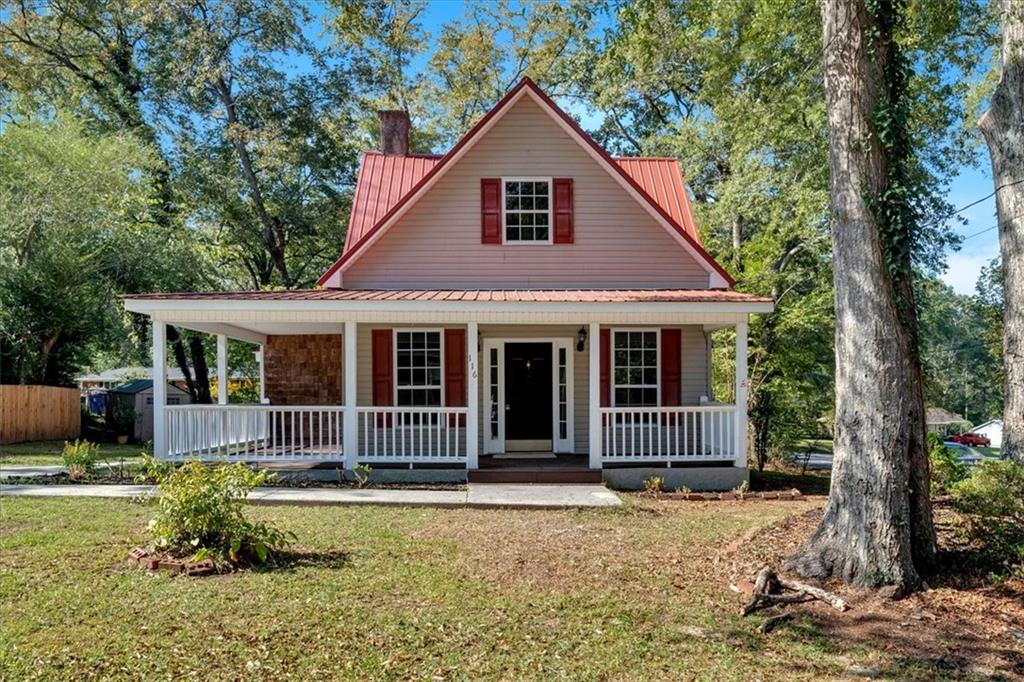116 Tallapoosa Street Temple, GA 30179 - Photo 1 of 1 a front view of a house with garden