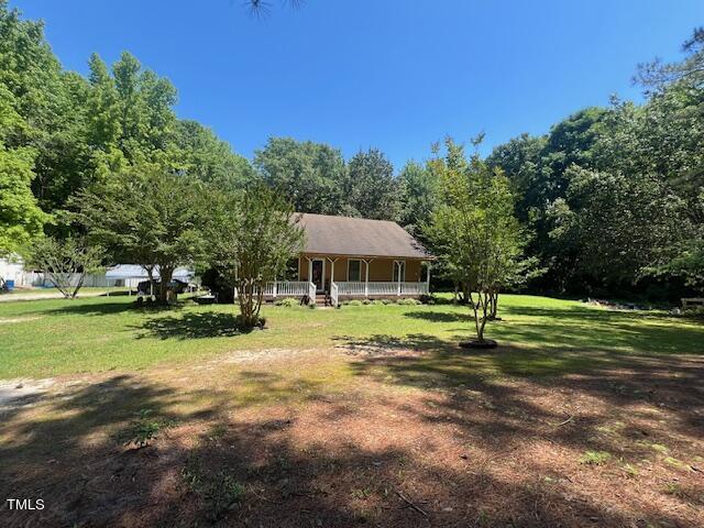 5368 Elevation Road Benson, NC 27504 - Photo 1 of 40 a house with trees in the background