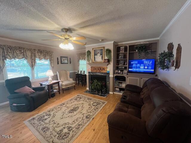 5368 Elevation Road Benson, NC 27504 - Photo 11 of 40 a living room with furniture a rug and a fireplace