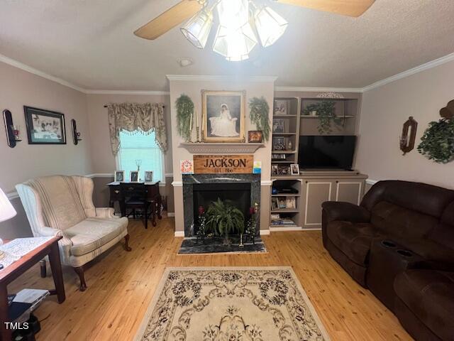 5368 Elevation Road Benson, NC 27504 - Photo 15 of 40 a living room with furniture a flat screen tv and a fireplace