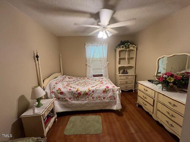 5368 Elevation Road Benson, NC 27504 - Photo 16 of 40 a bedroom with a bed and furniture