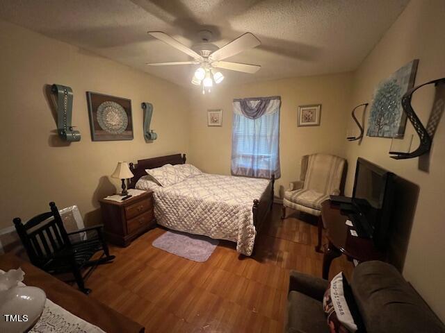 5368 Elevation Road Benson, NC 27504 - Photo 20 of 40 a bedroom with a bed window and couch