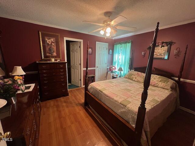 5368 Elevation Road Benson, NC 27504 - Photo 22 of 40 a bedroom with a bed and a chandelier