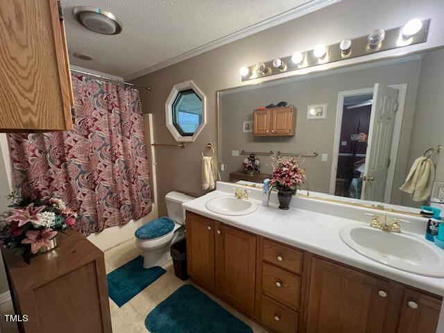 5368 Elevation Road Benson, NC 27504 - Photo 23 of 40 a bathroom with a double vanity sink mirror and toilet