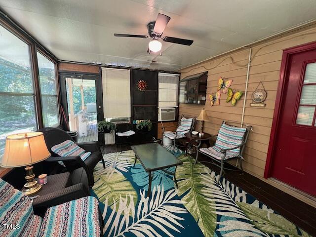 5368 Elevation Road Benson, NC 27504 - Photo 27 of 40 a living room with furniture and floor to ceiling windows