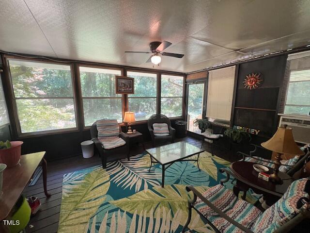 5368 Elevation Road Benson, NC 27504 - Photo 28 of 40 a living room with furniture and a floor to ceiling window