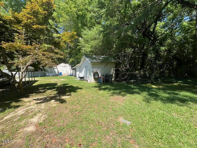 5368 Elevation Road Benson, NC 27504 - Photo 34 of 40 a backyard of a house with lots of green space