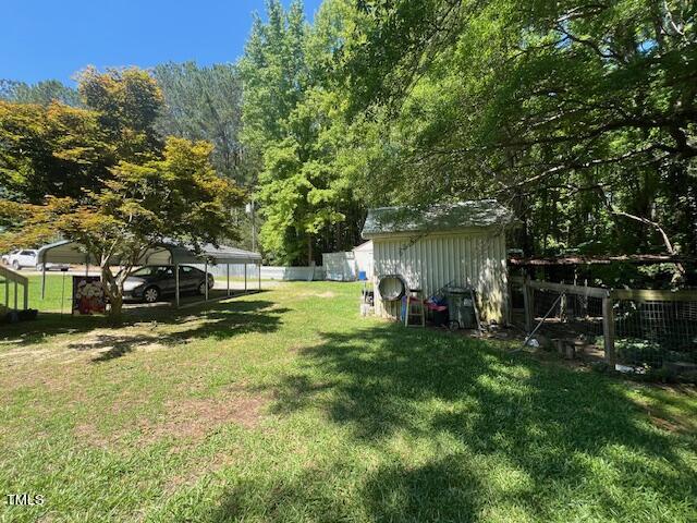 5368 Elevation Road Benson, NC 27504 - Photo 36 of 40 a view of a house with a yard