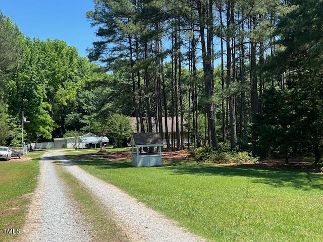 5368 Elevation Road Benson, NC 27504 - Photo 38 of 40 a view of swimming pool with lawn chairs and plants