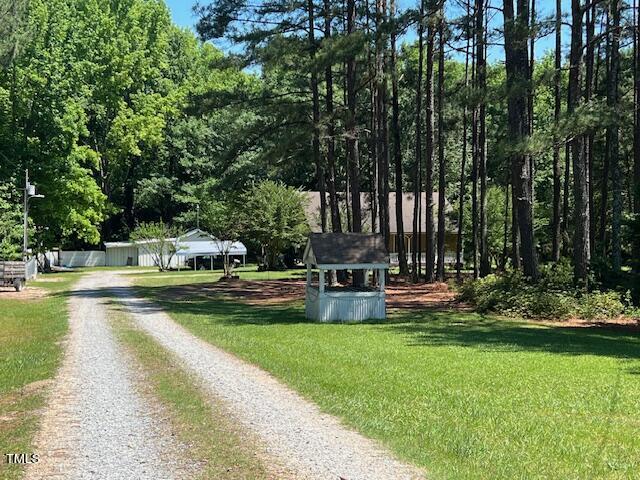 5368 Elevation Road Benson, NC 27504 - Photo 40 of 40 a view of swimming pool with lawn chairs and large trees