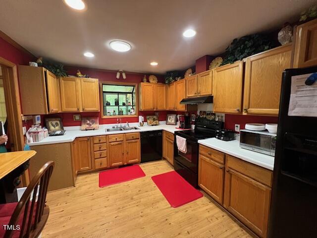 5368 Elevation Road Benson, NC 27504 - Photo 4 of 40 a kitchen with stainless steel appliances kitchen island granite countertop a stove a sink dishwasher and a microwave