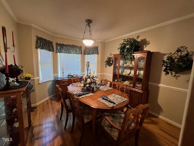5368 Elevation Road Benson, NC 27504 - Photo 10 of 40 a view of a dining room with furniture and wooden floor