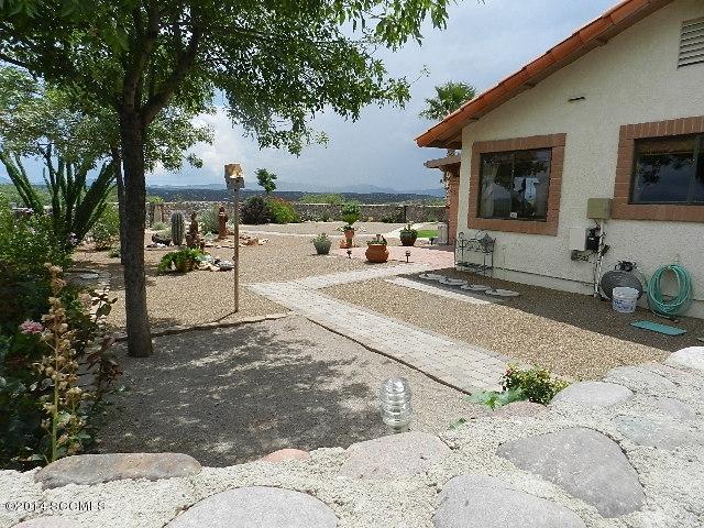 471 Camino Providencia Rio Rico, AZ 85648 - Photo 32 of 49 a view of a chair and tables in the patio