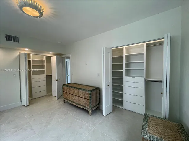 a view of room with window and furniture