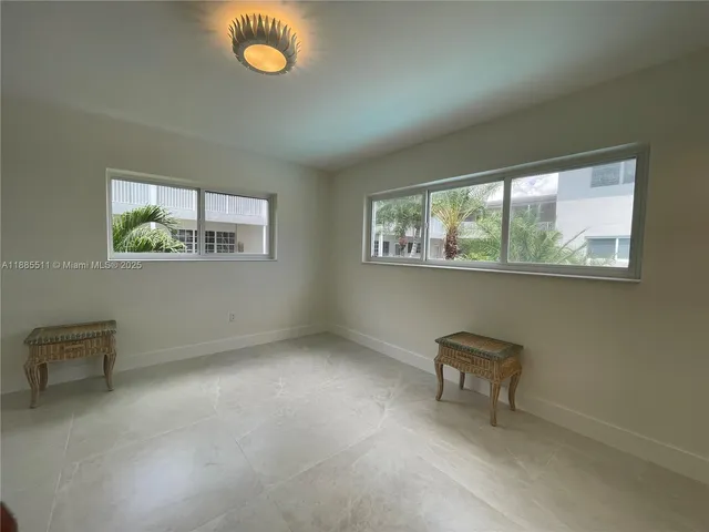 a bathroom with a sink mirror and toilet