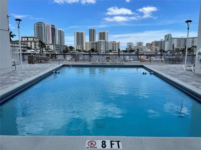a view of a living room and kitchen
