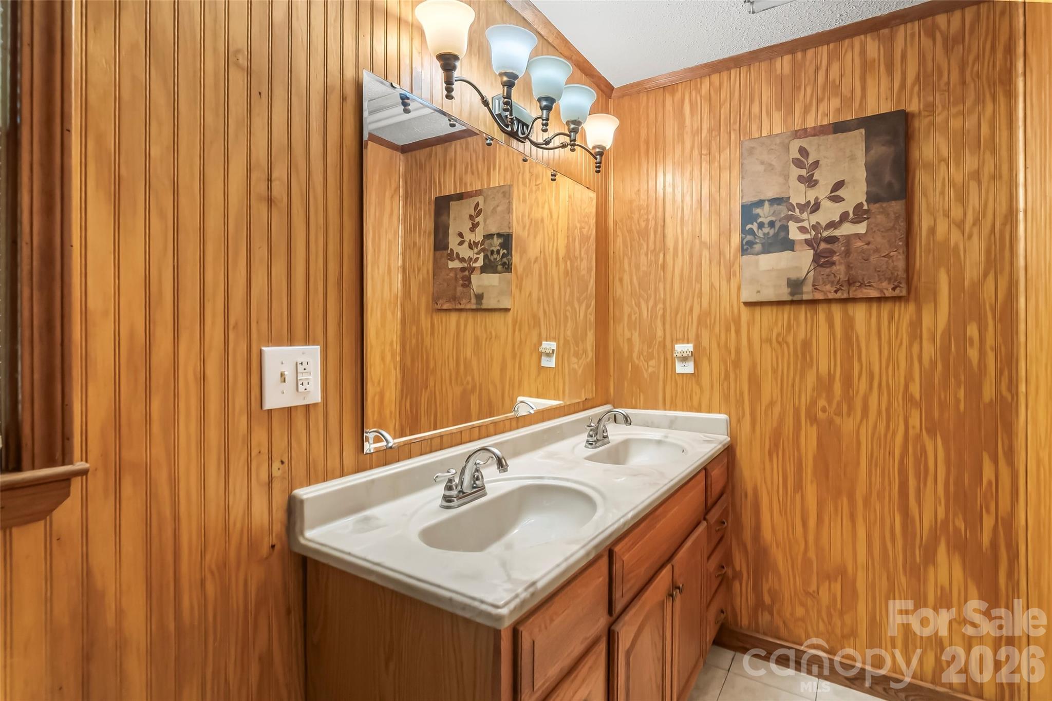 242 Plott Balsam Road Maggie Valley, NC 28751 - Photo 14 of 32 a bathroom with a sink and a mirror