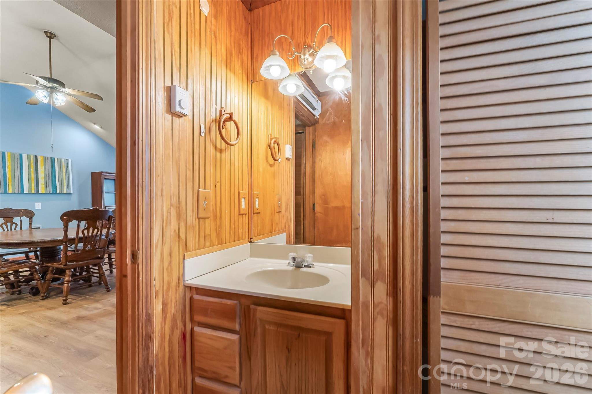 242 Plott Balsam Road Maggie Valley, NC 28751 - Photo 18 of 32 a bathroom with a sink and a mirror