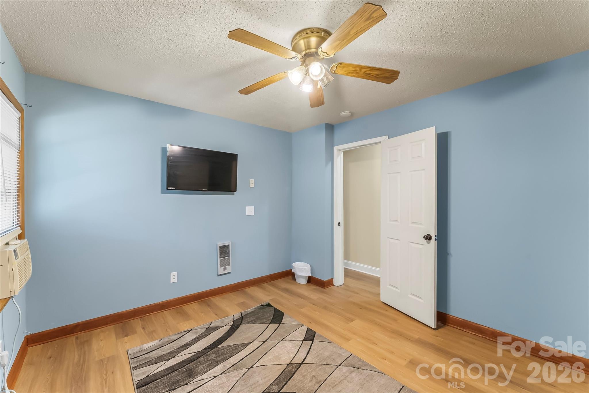 242 Plott Balsam Road Maggie Valley, NC 28751 - Photo 20 of 32 a view of a livingroom with a flat screen tv