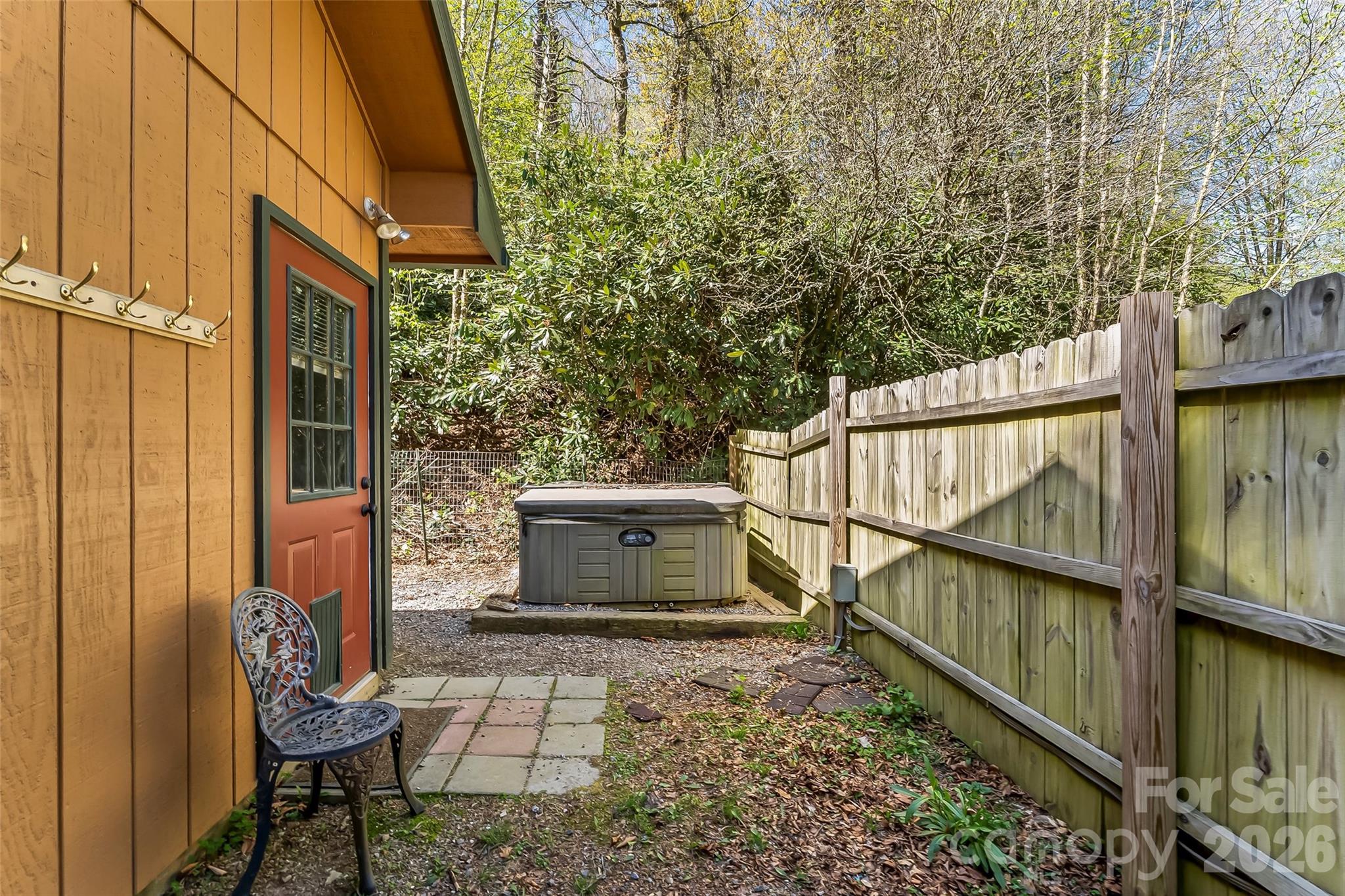 242 Plott Balsam Road Maggie Valley, NC 28751 - Photo 23 of 32 a view of a balcony with chairs and wooden fence