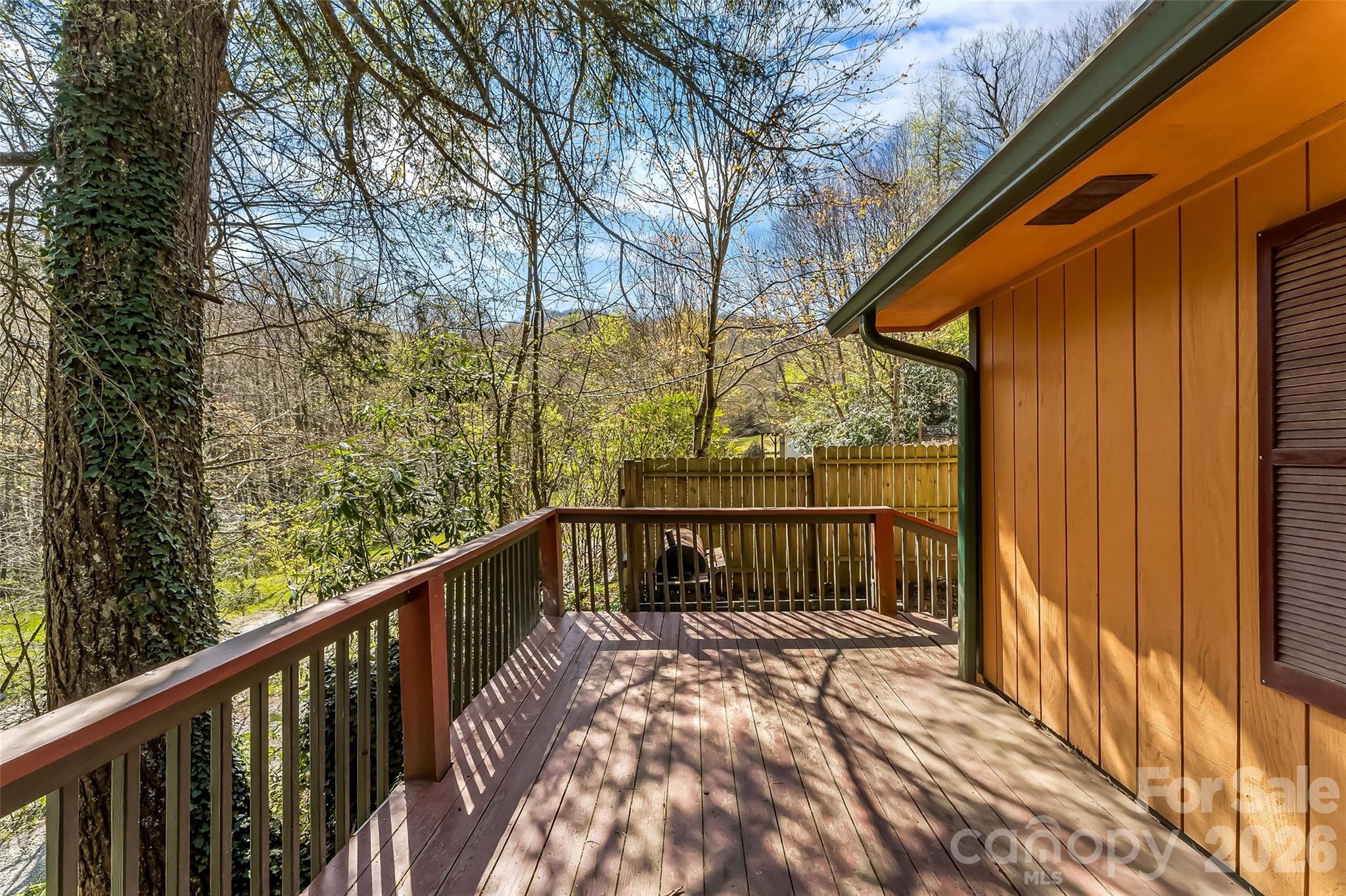 242 Plott Balsam Road Maggie Valley, NC 28751 - Photo 24 of 32 a view of balcony with wooden floor and fence