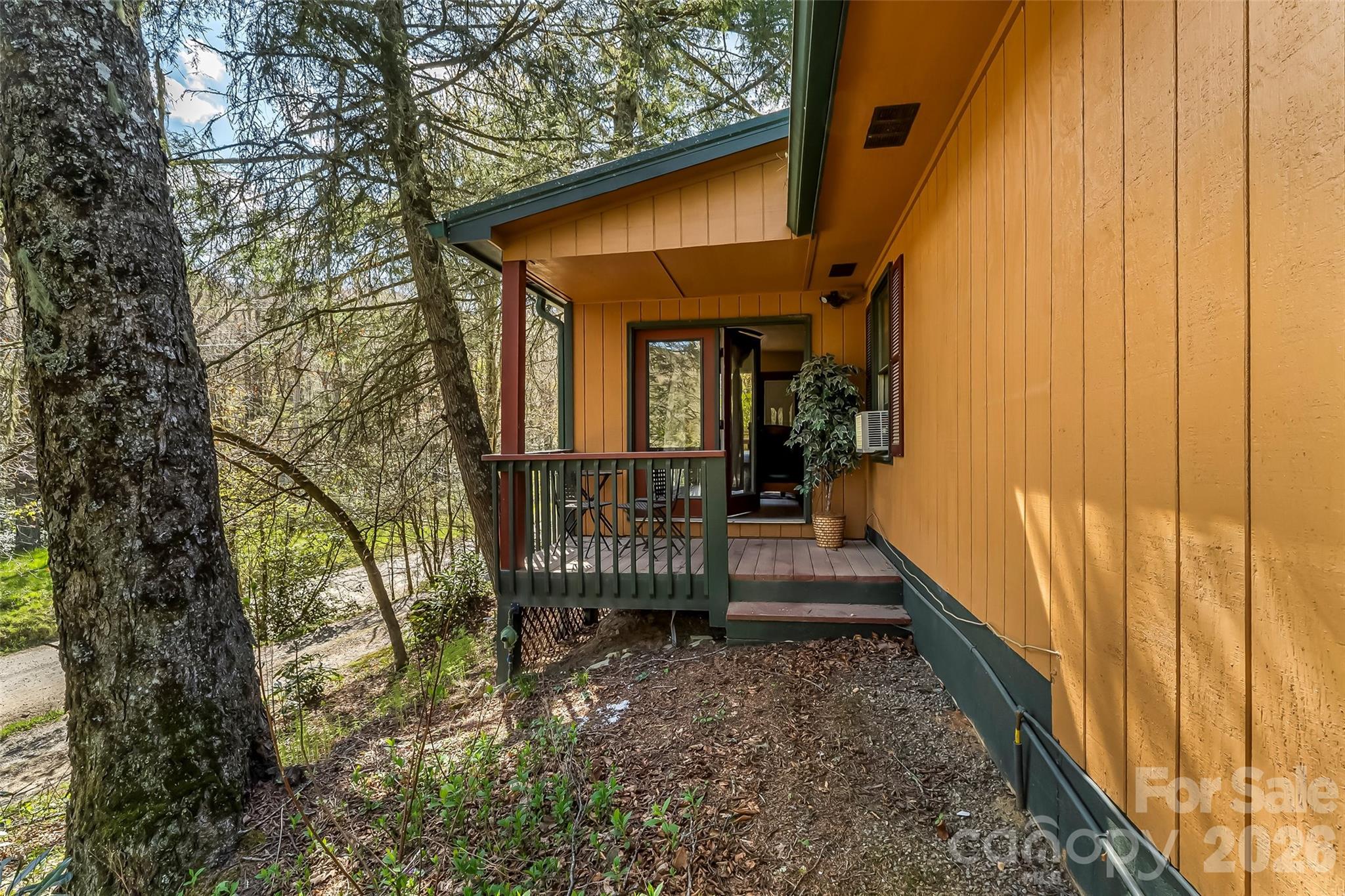 242 Plott Balsam Road Maggie Valley, NC 28751 - Photo 25 of 32 a view of a house with a small porch