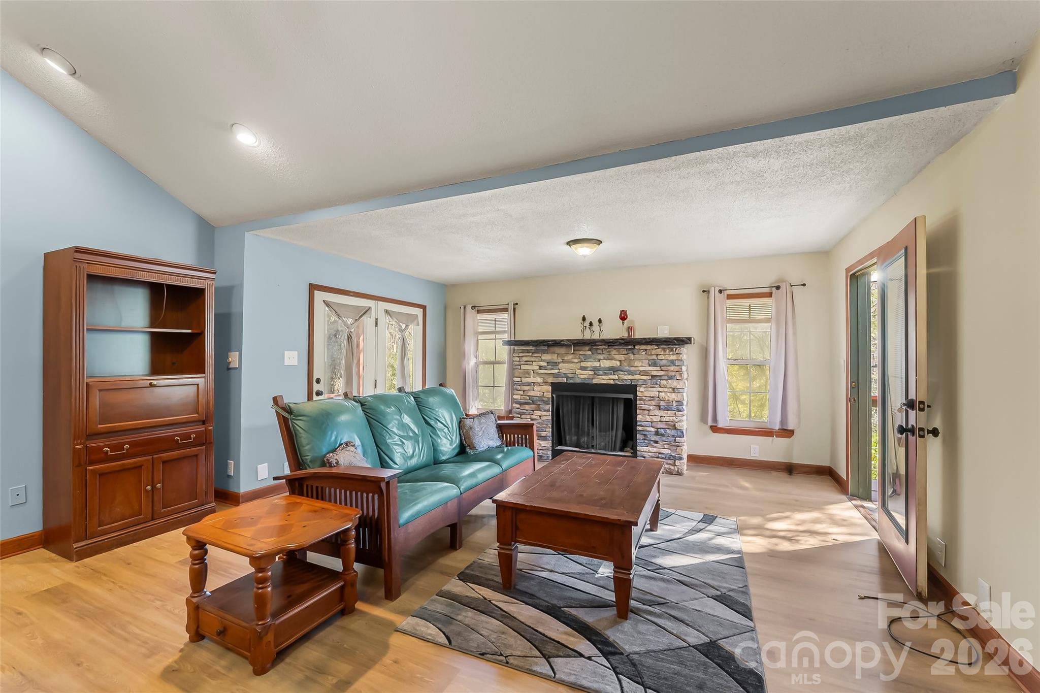 242 Plott Balsam Road Maggie Valley, NC 28751 - Photo 6 of 32 a living room with furniture and a fireplace