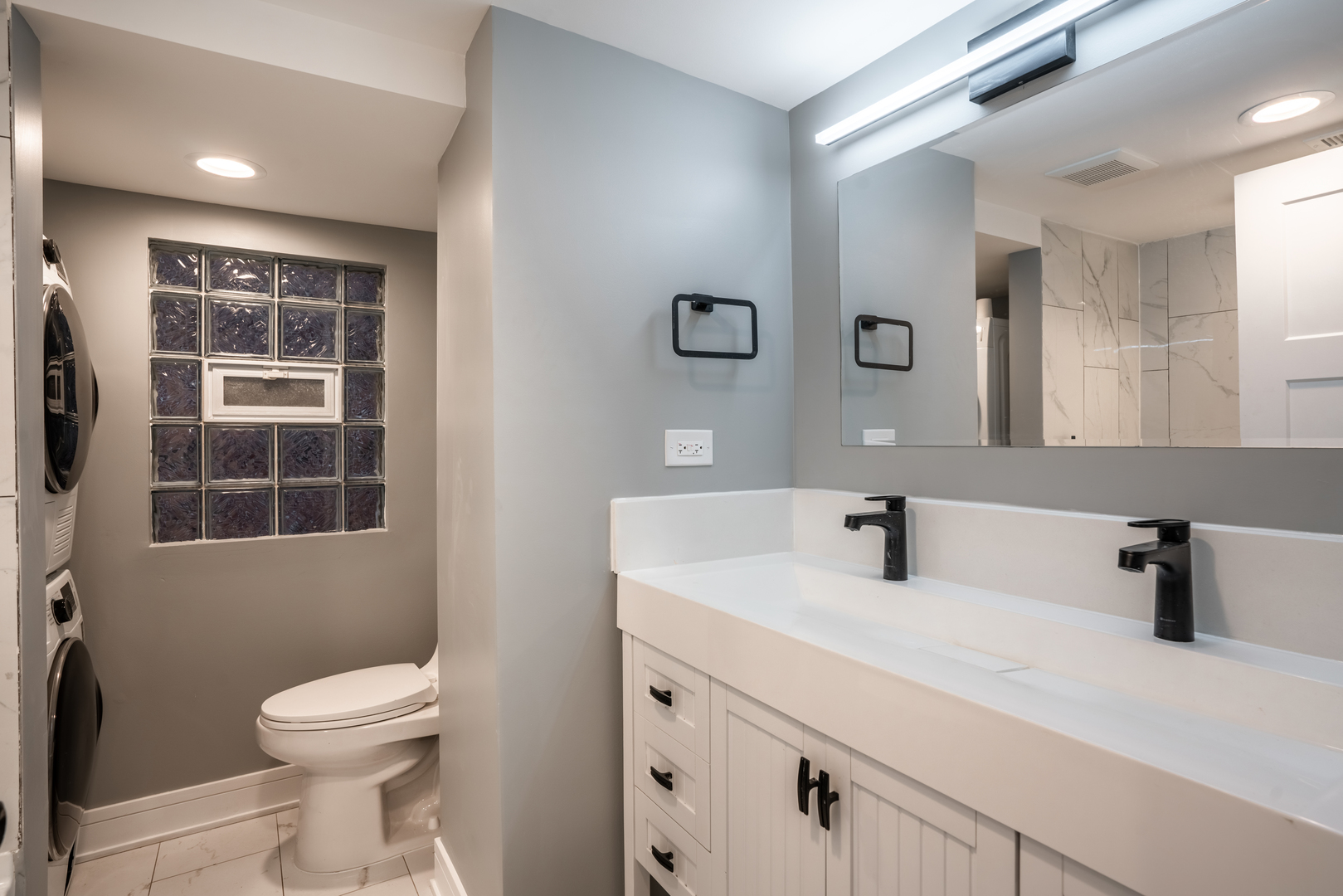 4624 North Springfield Avenue Chicago, IL 60625 - Photo 13 of 44 a bathroom with a sink a toilet and a mirror