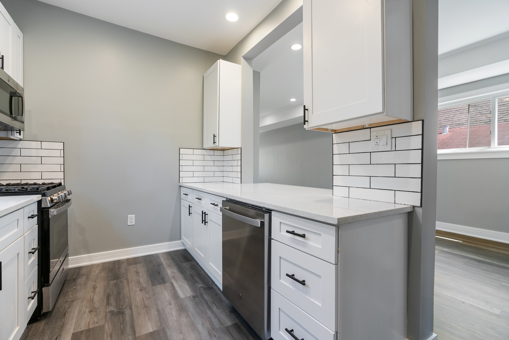 4624 North Springfield Avenue Chicago, IL 60625 - Photo 21 of 44 a kitchen with granite countertop a sink and a stove top oven