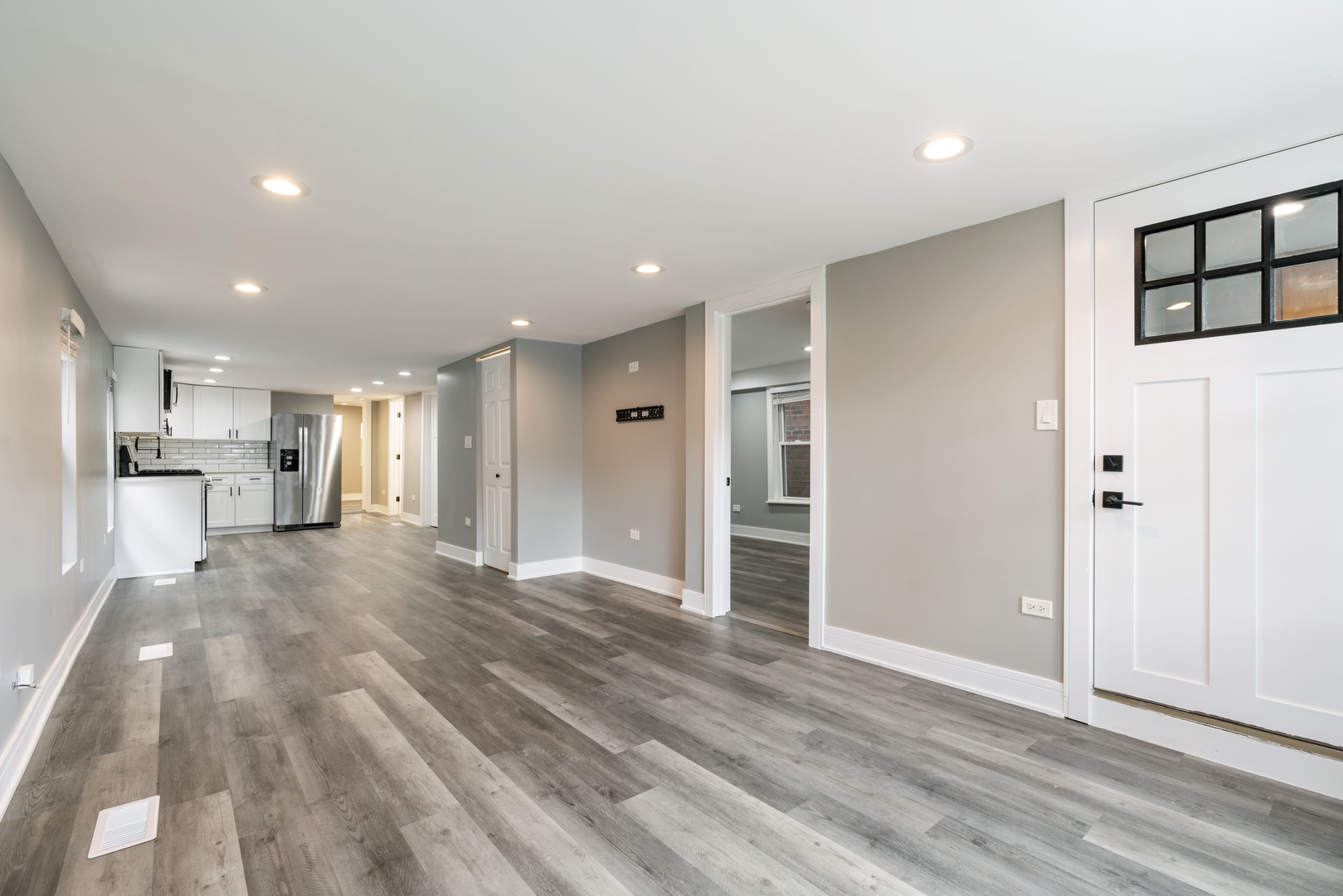 4624 North Springfield Avenue Chicago, IL 60625 - Photo 3 of 44 a view of a kitchen with wooden floor and a refrigerator