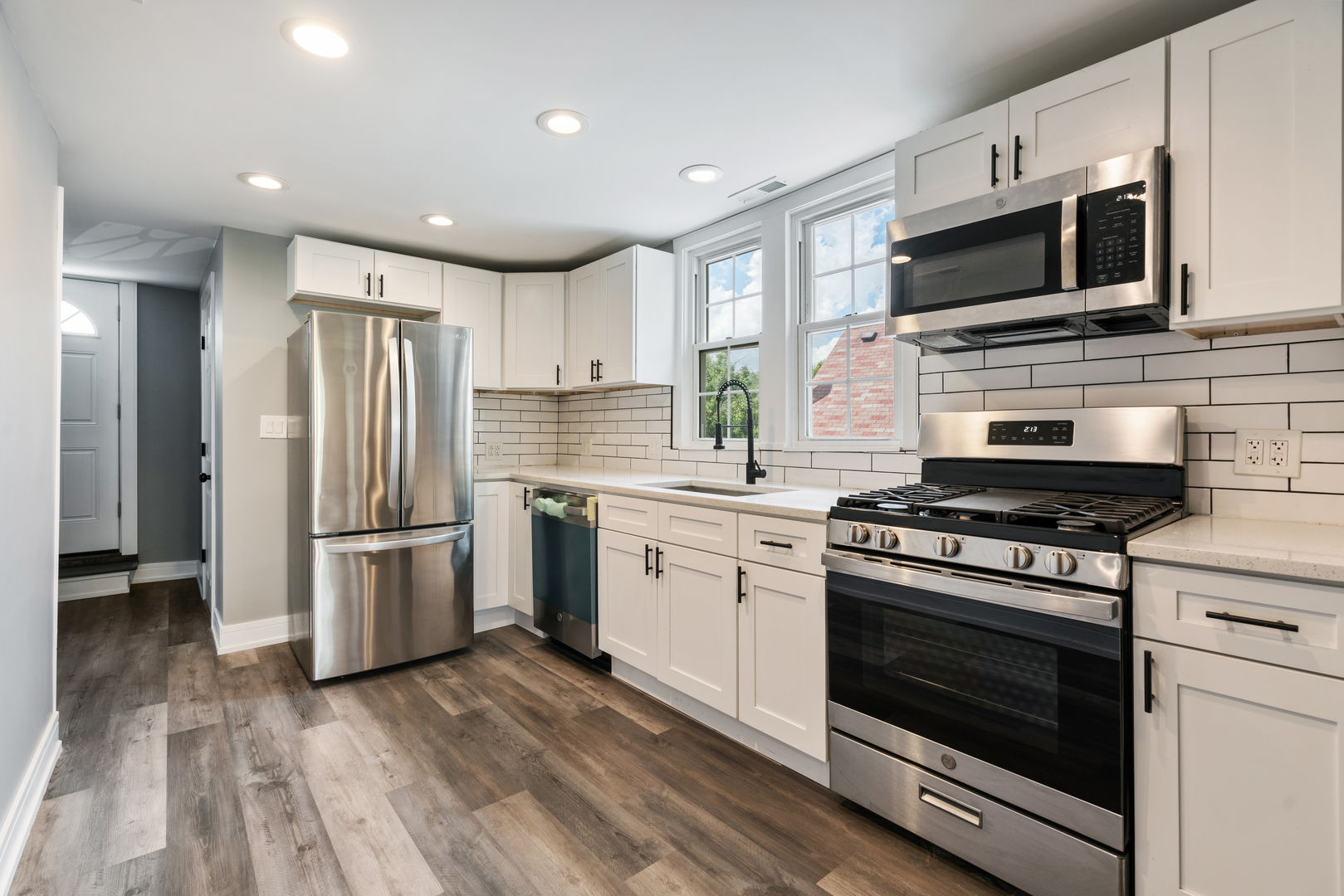4624 North Springfield Avenue Chicago, IL 60625 - Photo 31 of 44 a kitchen with stainless steel appliances a stove microwave and refrigerator