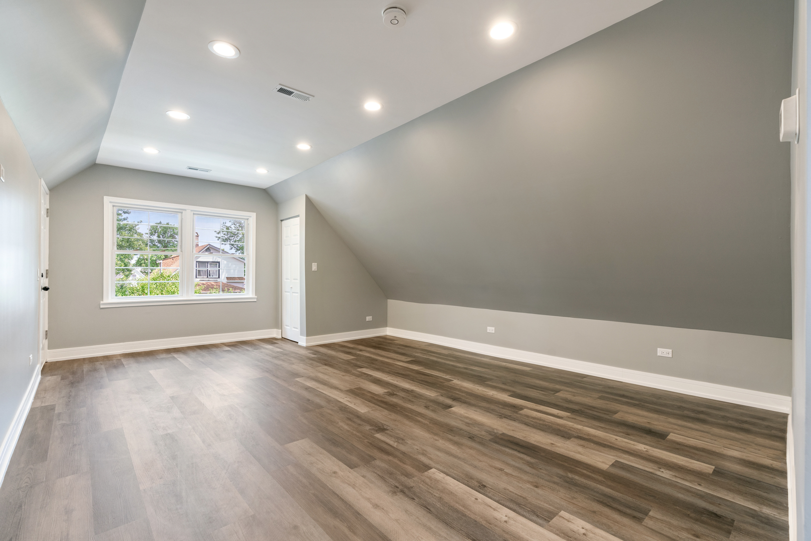 4624 North Springfield Avenue Chicago, IL 60625 - Photo 32 of 44 wooden floor in an empty room with a window