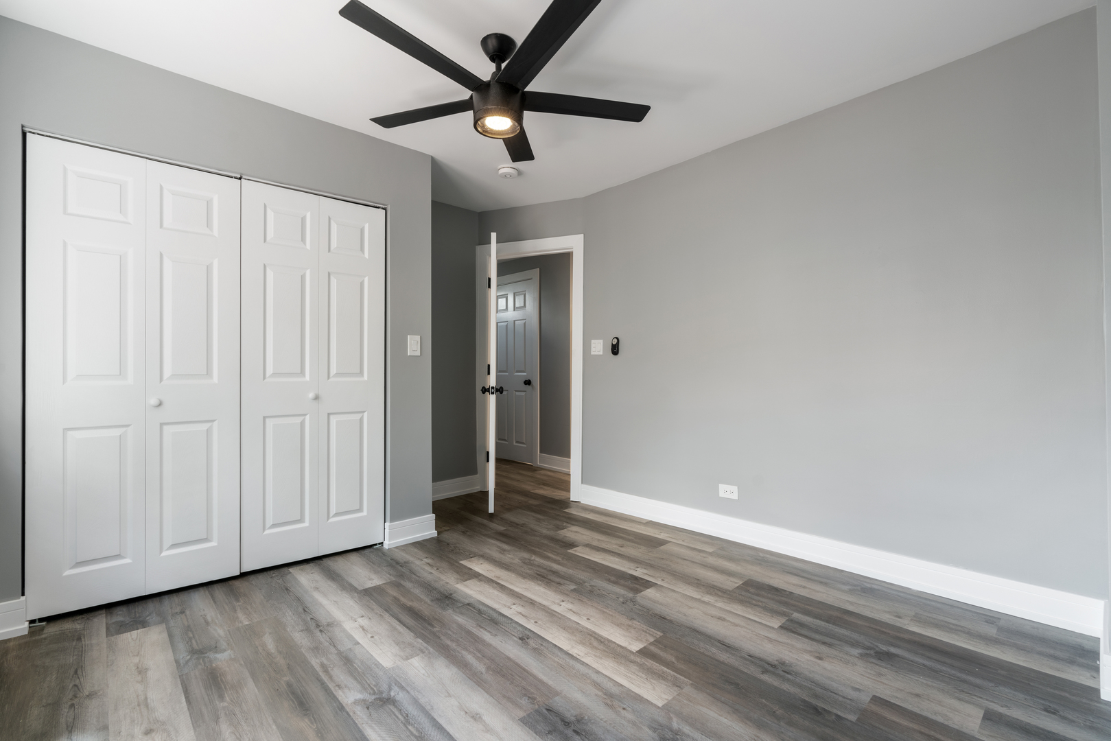 4624 North Springfield Avenue Chicago, IL 60625 - Photo 36 of 44 an empty room with wooden floor and windows
