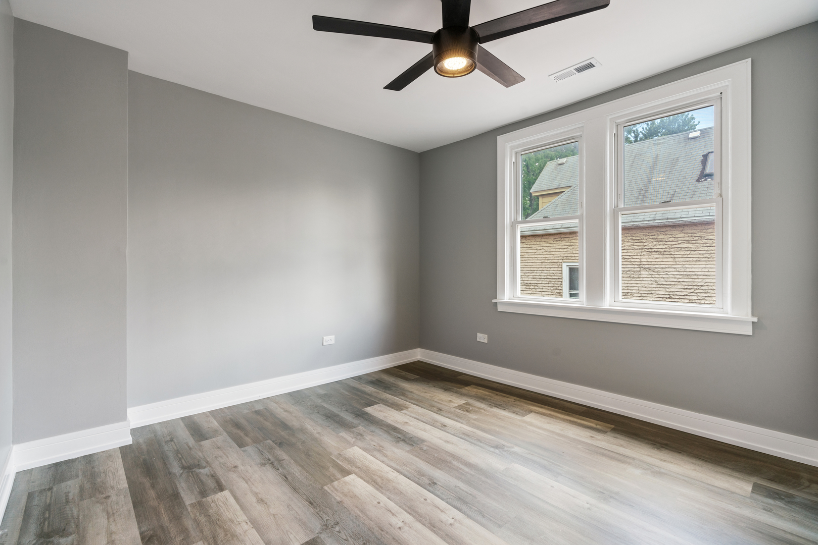 4624 North Springfield Avenue Chicago, IL 60625 - Photo 37 of 44 wooden floor in an empty room with a window