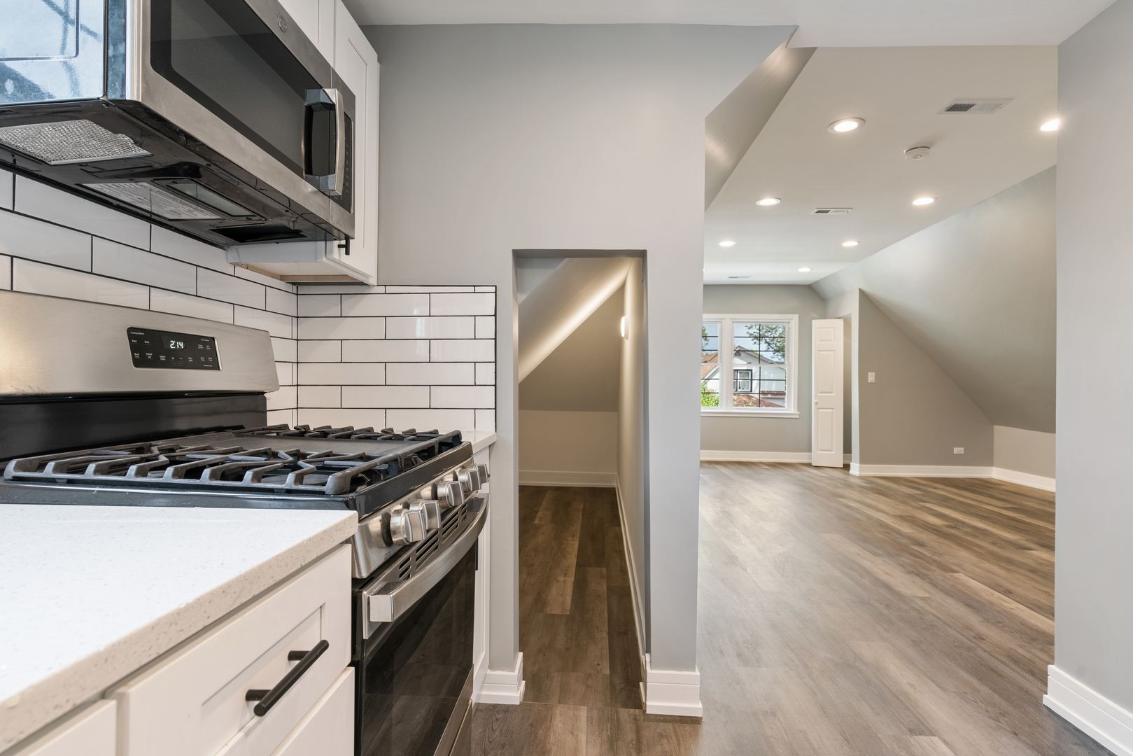 4624 North Springfield Avenue Chicago, IL 60625 - Photo 40 of 44 a kitchen with a stove and a microwave