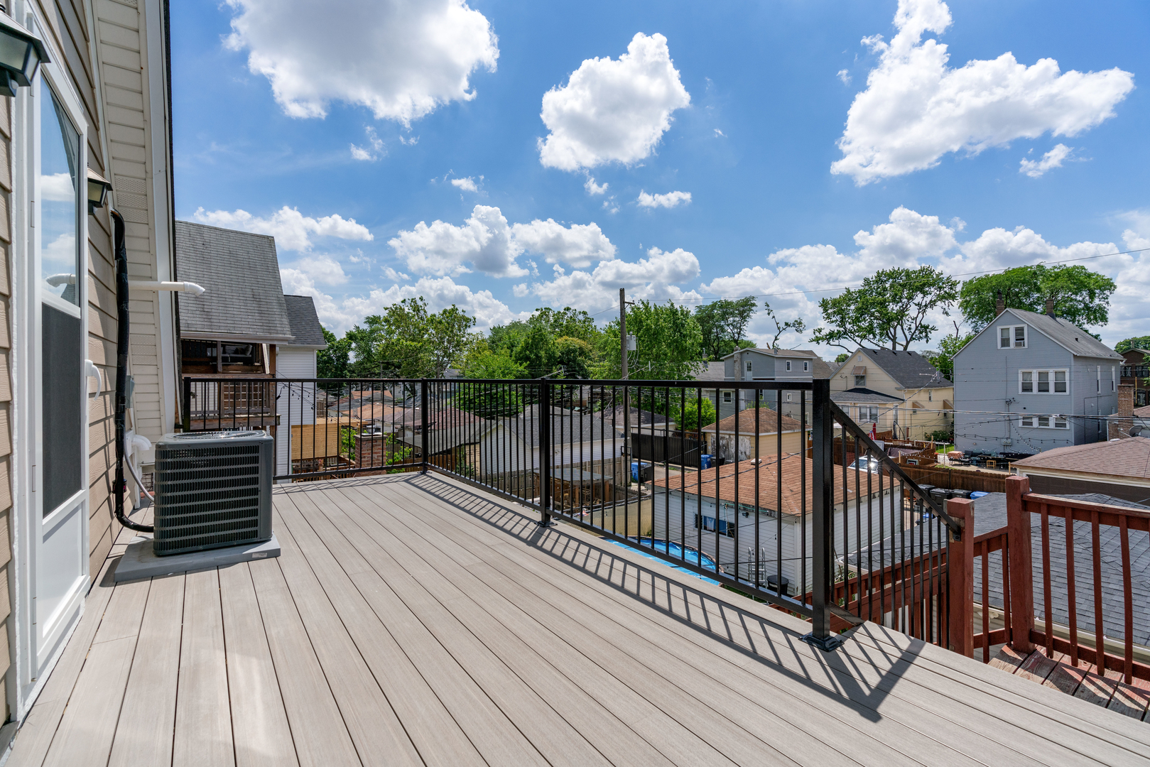 4624 North Springfield Avenue Chicago, IL 60625 - Photo 43 of 44 an outdoor view of a house with wooden floor
