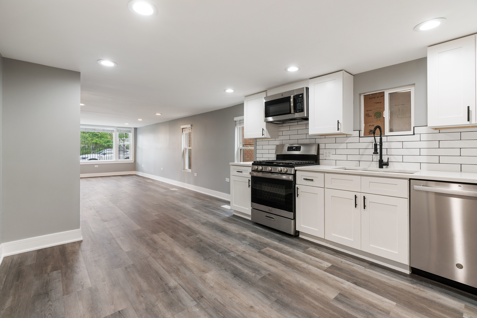4624 North Springfield Avenue Chicago, IL 60625 - Photo 6 of 44 a kitchen with granite countertop a refrigerator stove top oven and sink