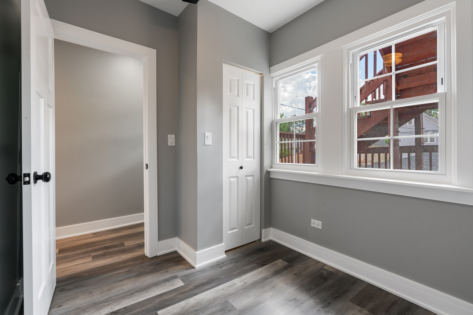 4624 North Springfield Avenue Chicago, IL 60625 - Photo 9 of 44 a view of empty room with window and wooden floor