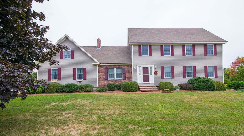 64 Chamberlain Road Westford, MA 01886 - Photo 1 of 27 a front view of a house with garden
