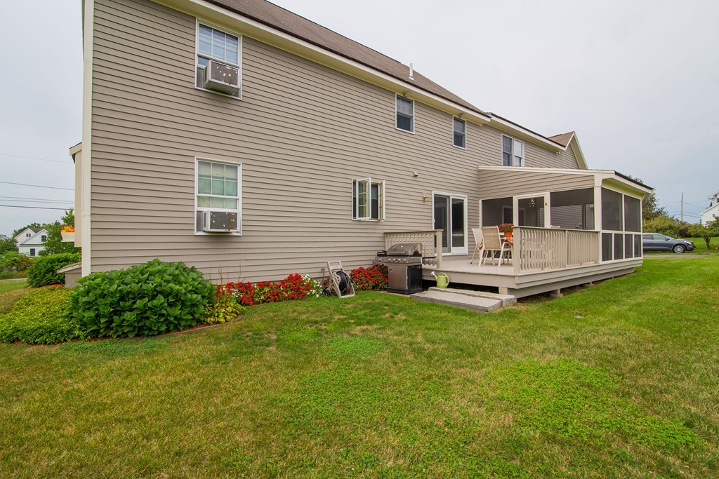 64 Chamberlain Road Westford, MA 01886 - Photo 23 of 27 a view of house with backyard and deck