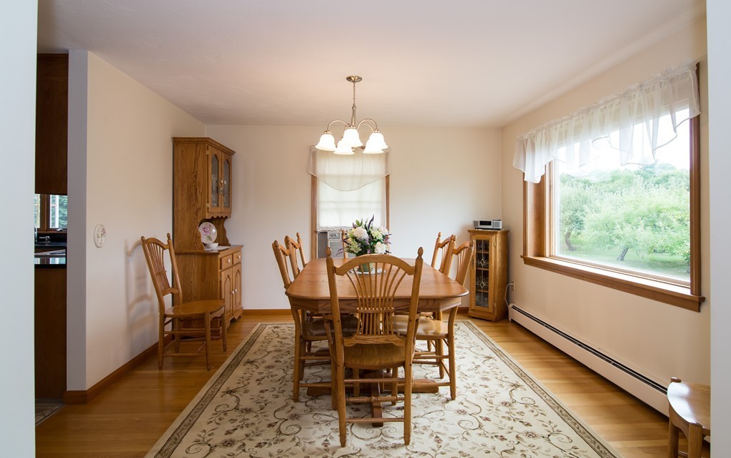 64 Chamberlain Road Westford, MA 01886 - Photo 8 of 27 a view of a dining room with furniture window and wooden floor
